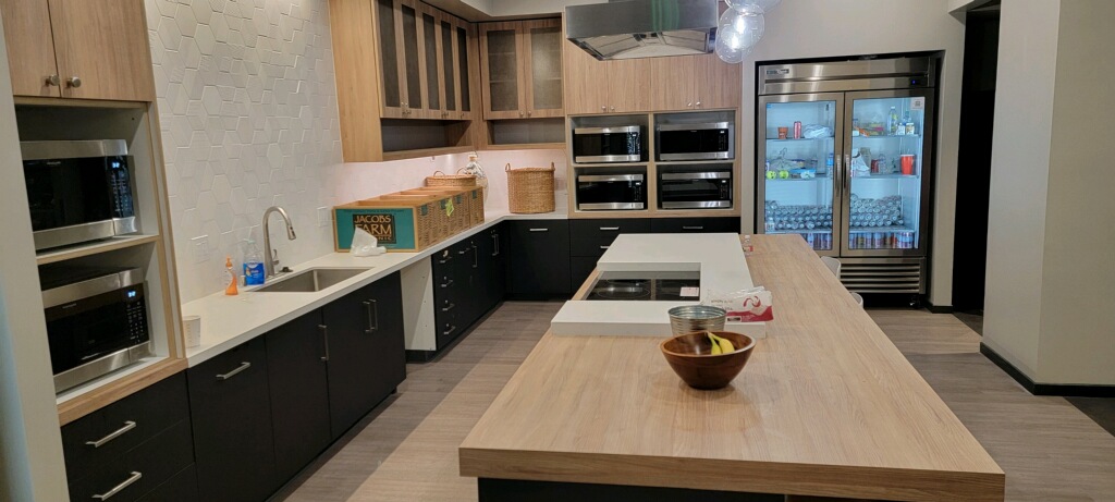 Break room built-in appliance. wood grain and solid surface combination.